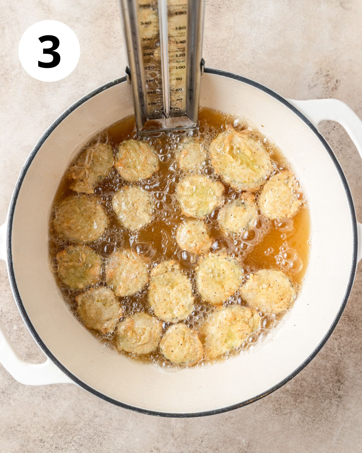 deep fried pickles in pot.