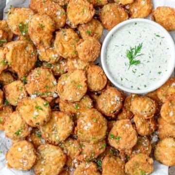 close up of homemade fried pickles with buttermilk ranch.