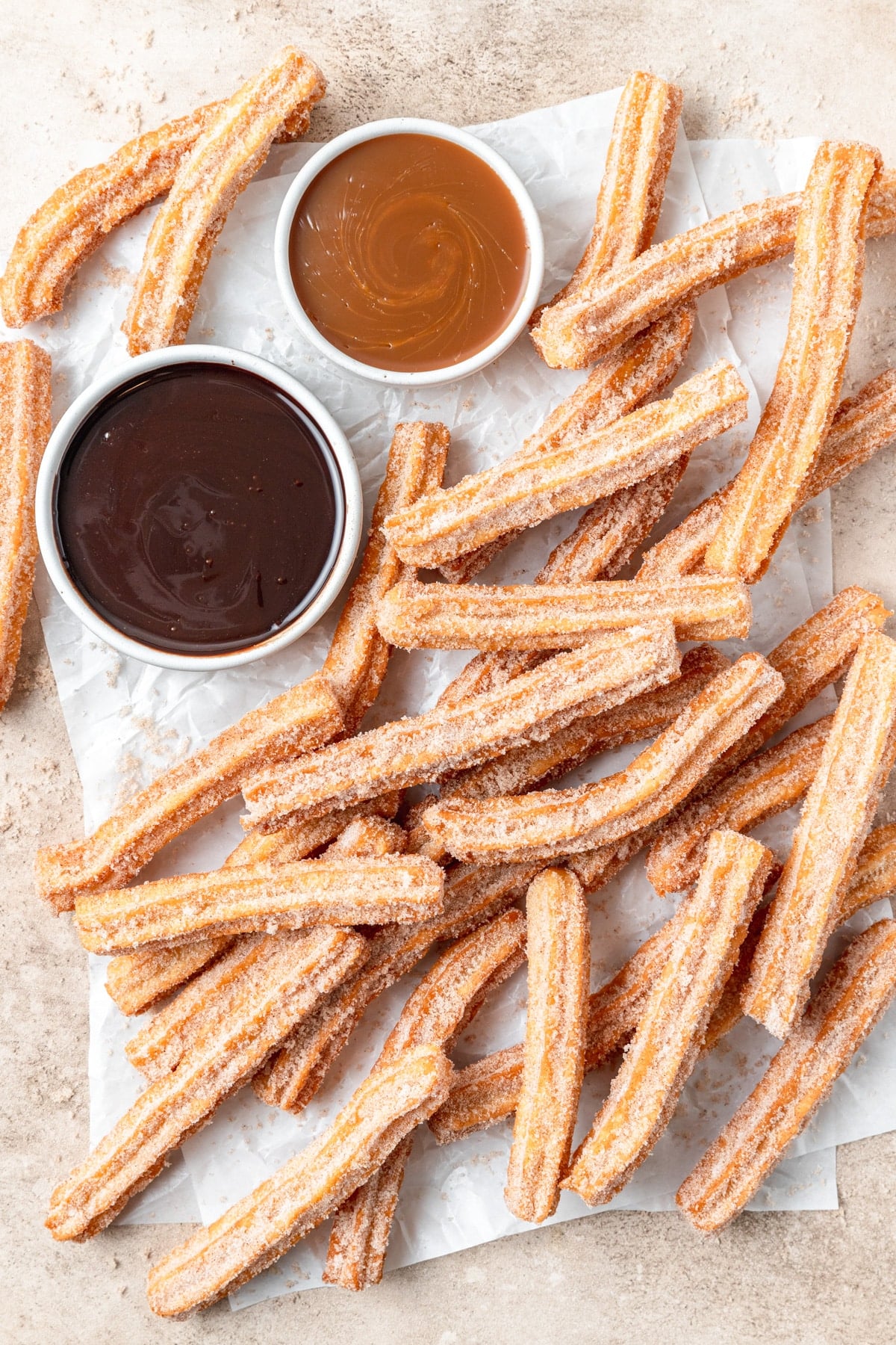 homemade churros with chocolate and caramel.