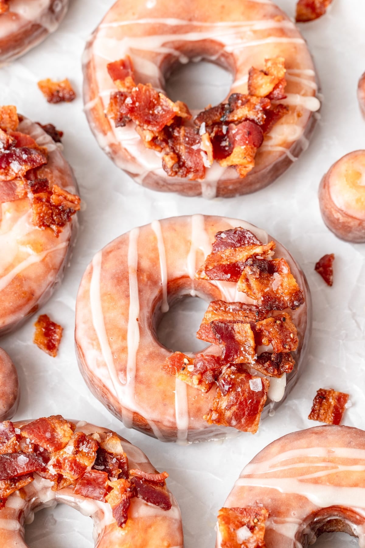 fried maple donuts topped with candied bacon.