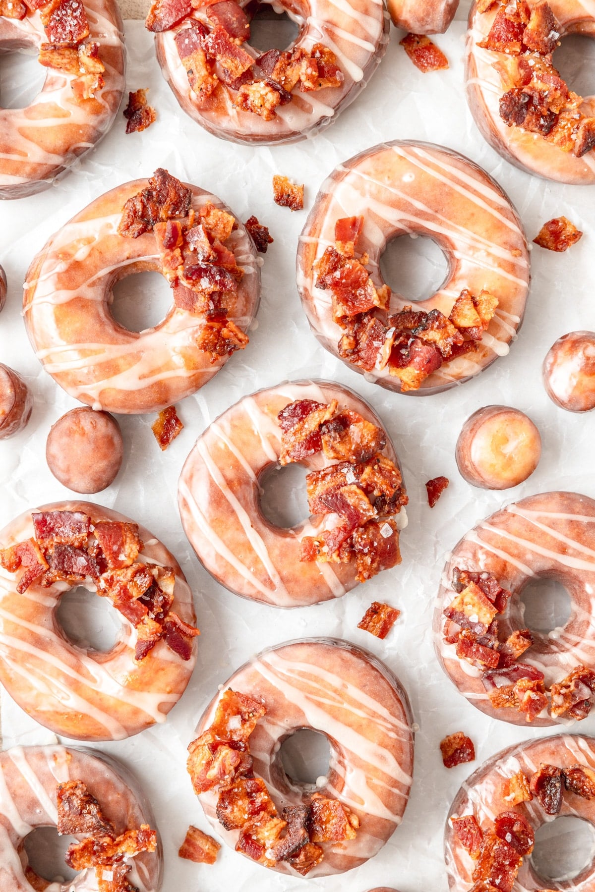 fried maple bacon donuts dipped in maple glaze.