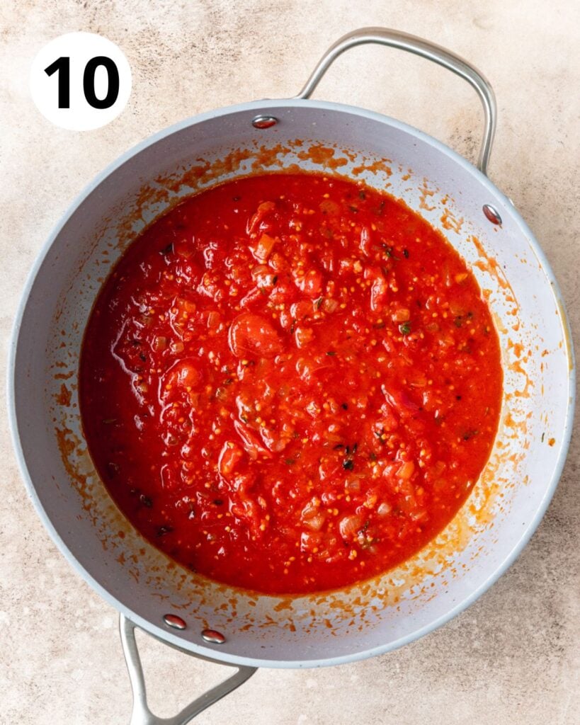 adding crushed tomatoes to sauce.