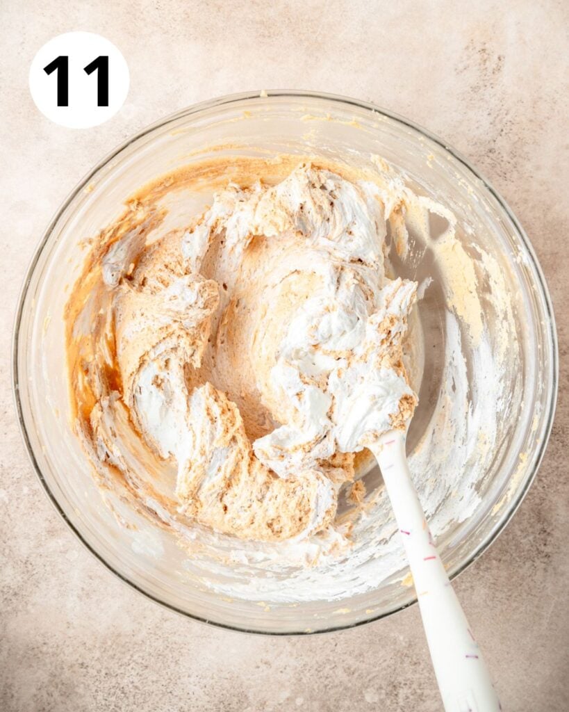 gently folding whipped cream into peanut butter.