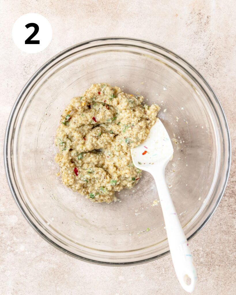 adding egg to mixture for meatballs.