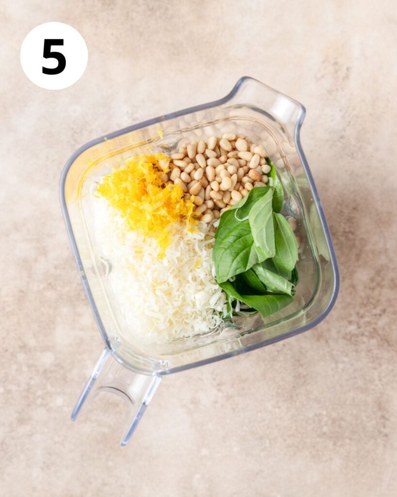 adding all broccoli pesto ingredients to blender.