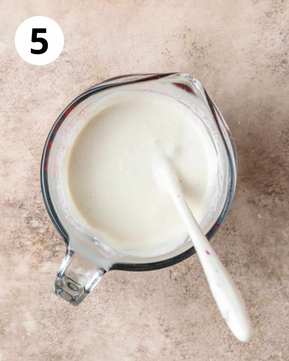 whisking together sourdough discard and buttermilk.