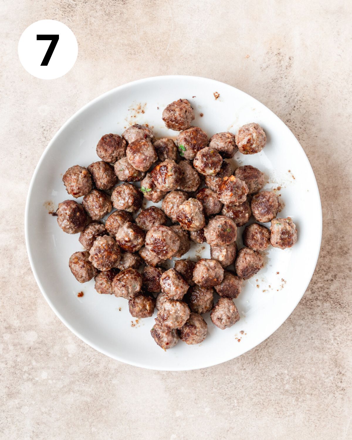 browned mini meatballs removed from pan and set aside.