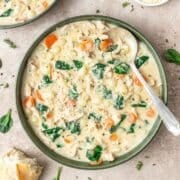 bowl of creamy chicken gnocchi soup with parmesan cheese.
