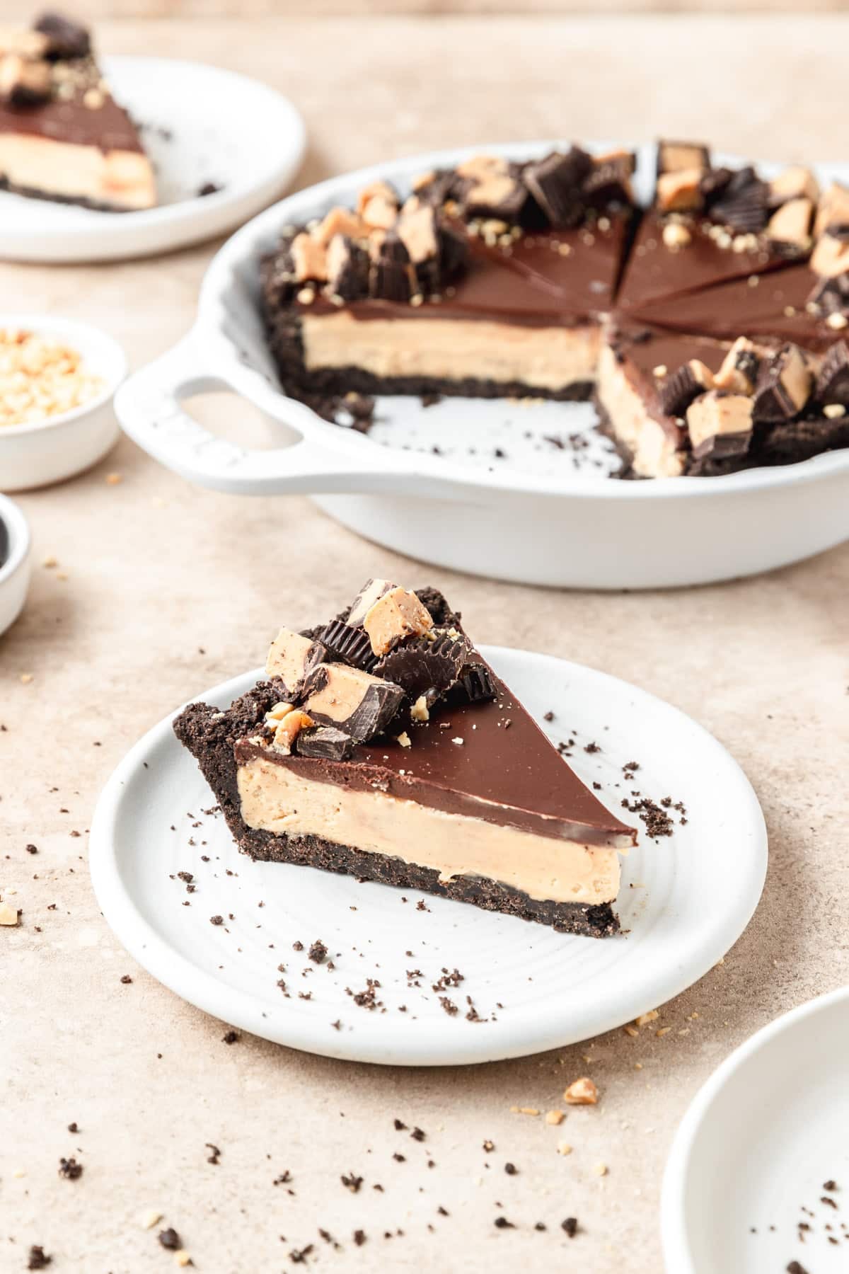 slice of dark chocolate peanut butter pie on plate.