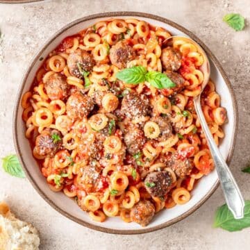 bowl of homemade spaghetti o's with mini meatballs.