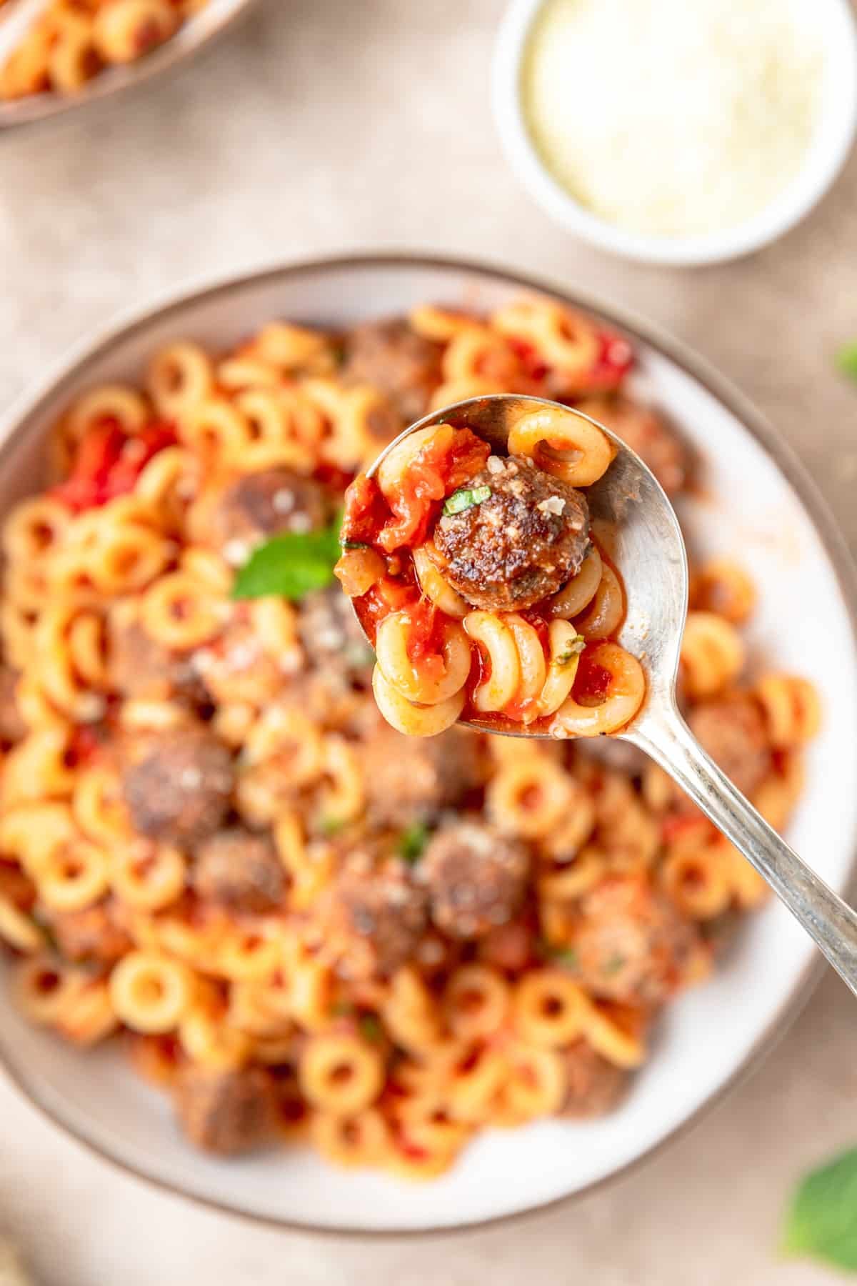 spoonful of spaghetti o's with mini meatballs.