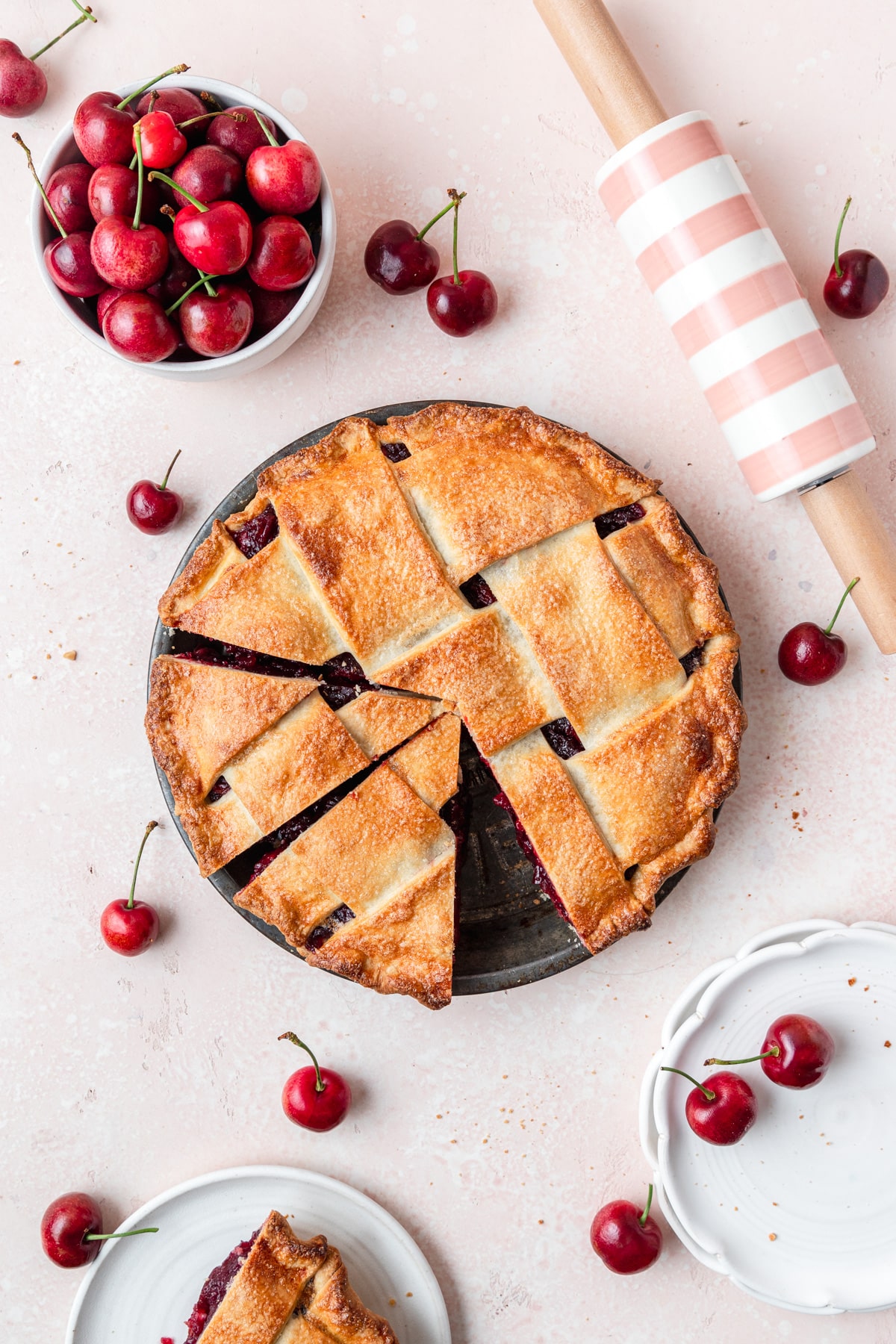 cherry pie with lattice crust cut into slices.