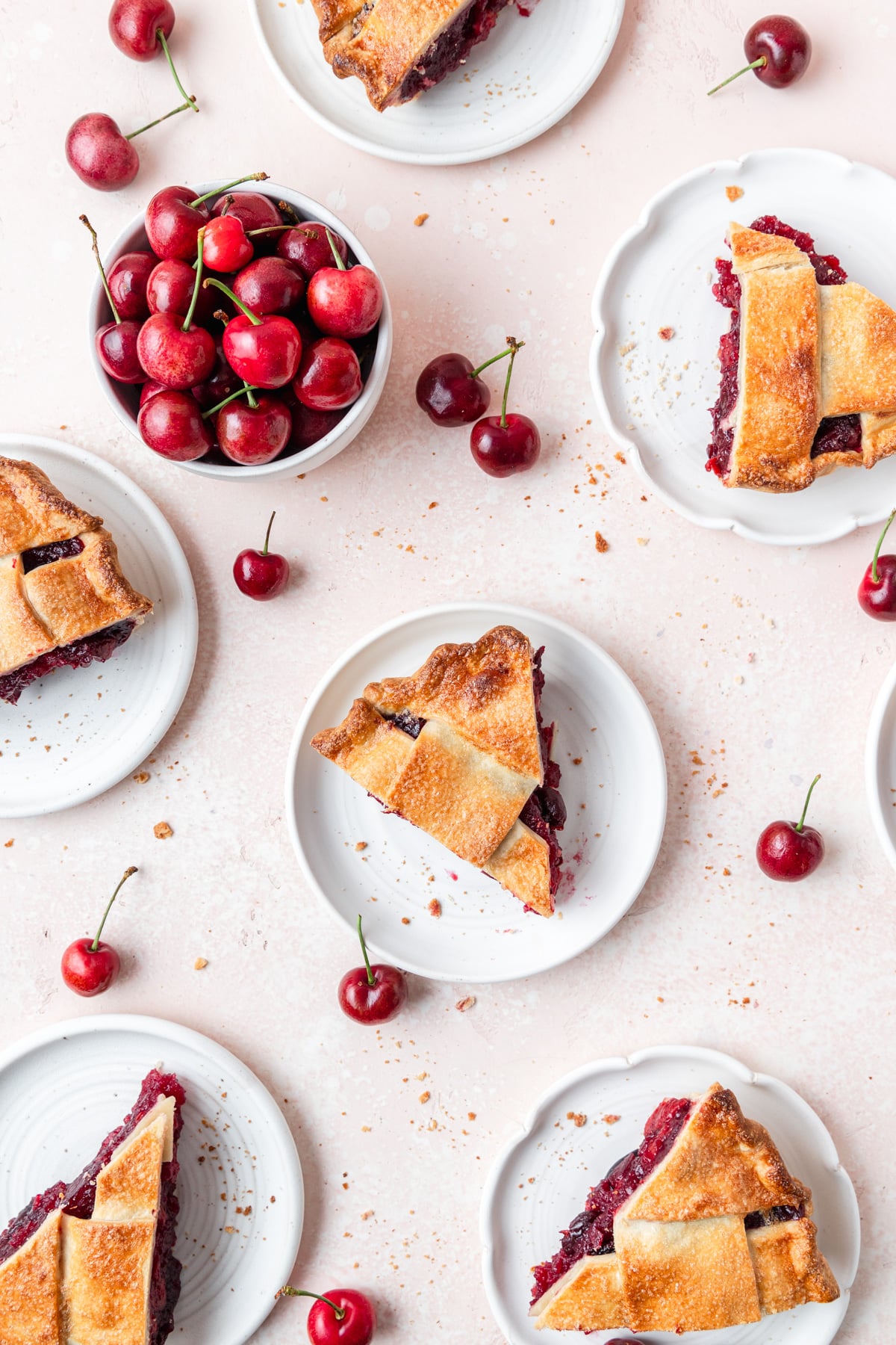slices of cherry pie on plates.