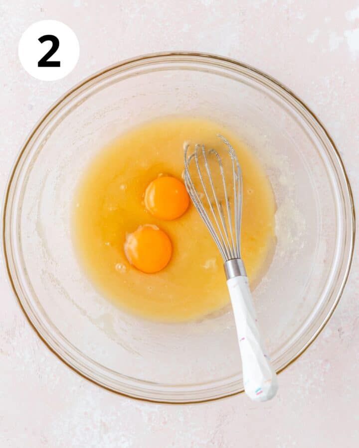 adding eggs to batter.