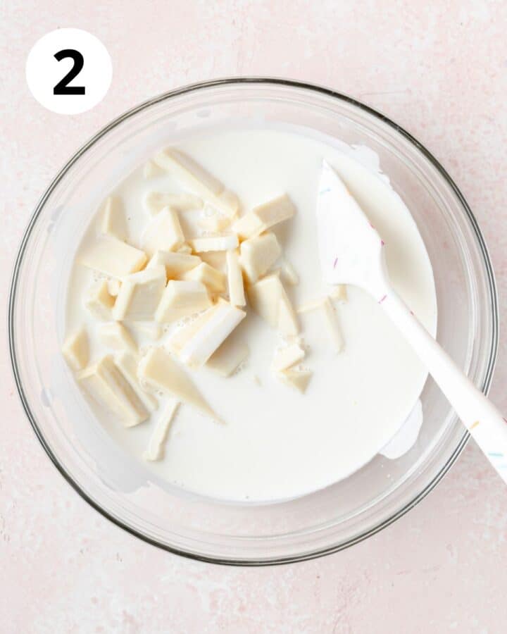 pouring hot cream over white chocolate.