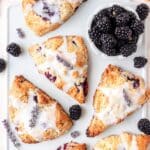 close up of blackberry lavender scones with lemon lavender glaze.