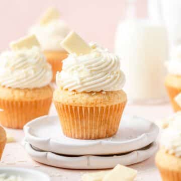 close up of white chocolate cupcakes with white chocolate ganache.