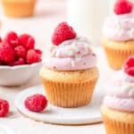 close up of white chocolate raspberry cupcakes.
