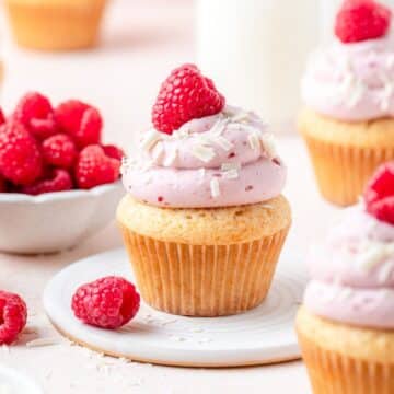close up of white chocolate raspberry cupcakes.