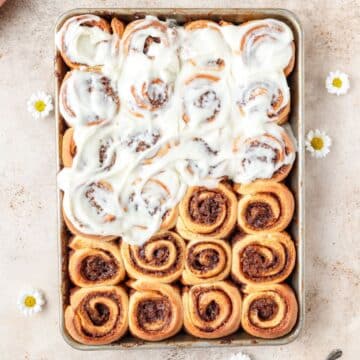 bite sized mini cinnamon rolls topped with cream cheese frosting.