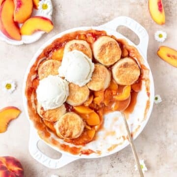 peach cobbler with cream biscuit topping.