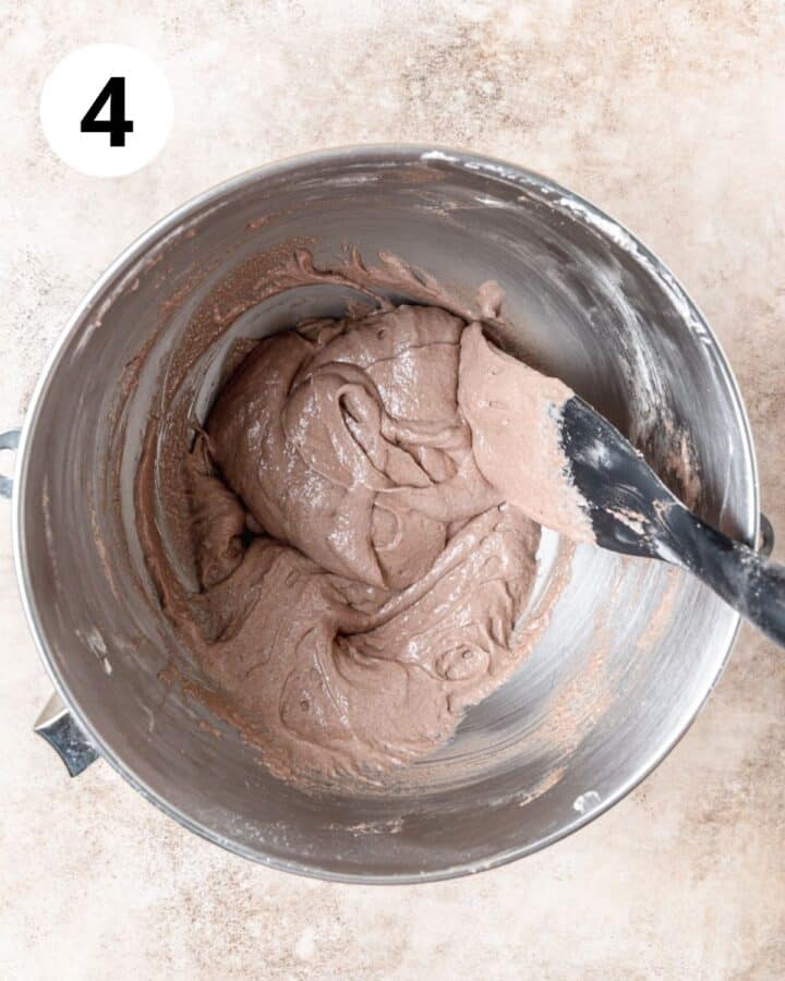 chocolate macaron batter forming figure 8.