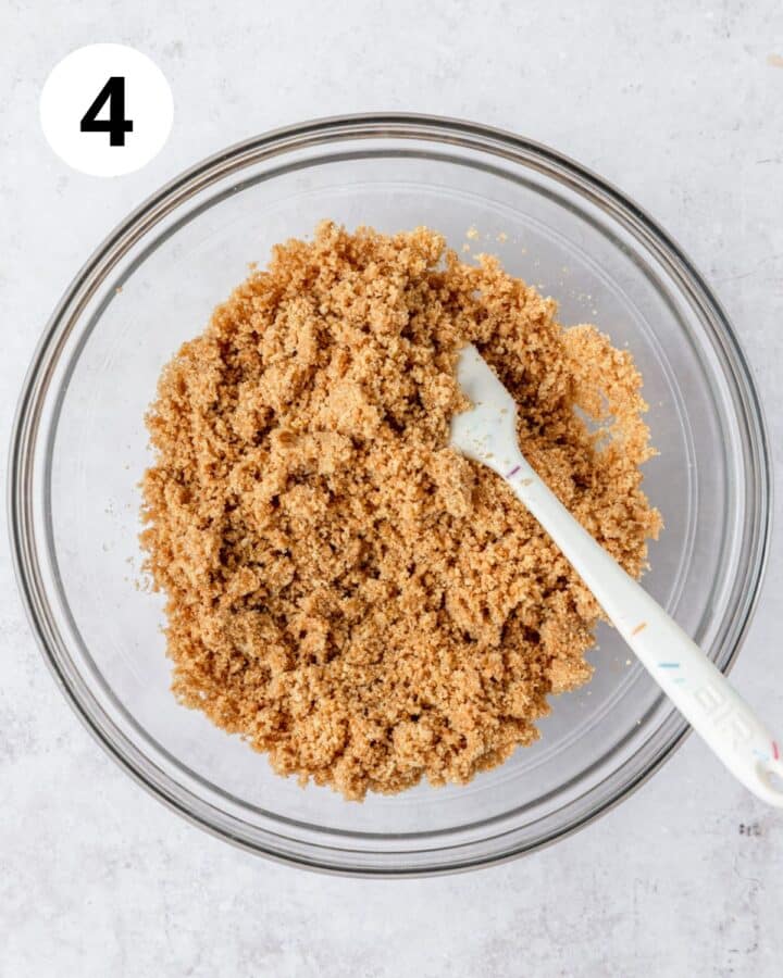 adding melted butter to graham cracker crumbs.