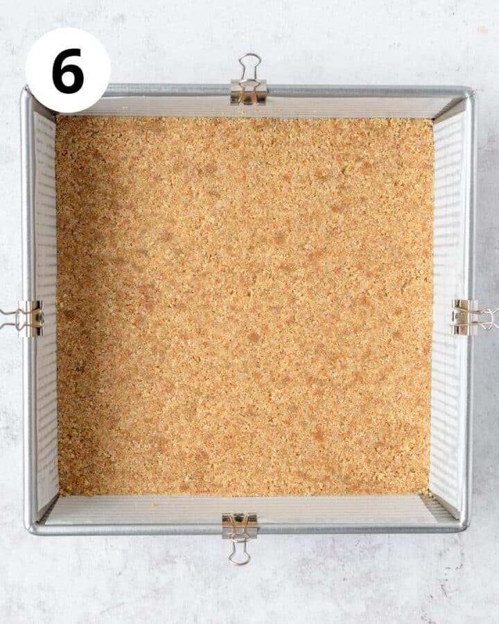 graham cracker crust pressed down into even layer in square pan.