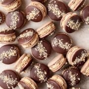 chocolate peanut butter macarons dipped in dark chocolate.