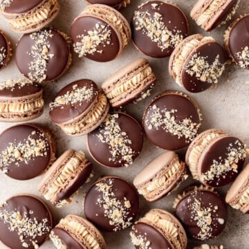 chocolate peanut butter macarons dipped in dark chocolate.