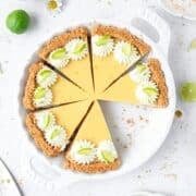 homemade key lime pie with graham cracker crust and topped with whipped cream.