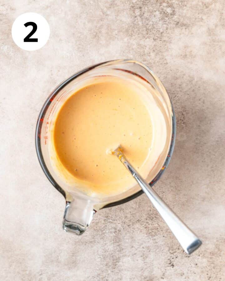 whisking pumpkin with cream and egg.
