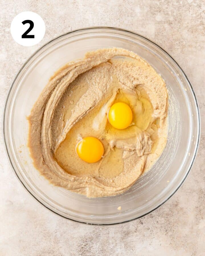 adding eggs to batter.