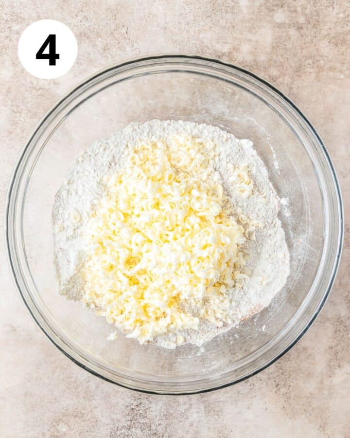 adding butter to dry ingredients. 