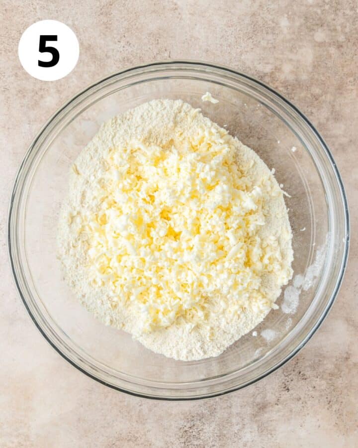 adding frozen butter to dry ingredients.
