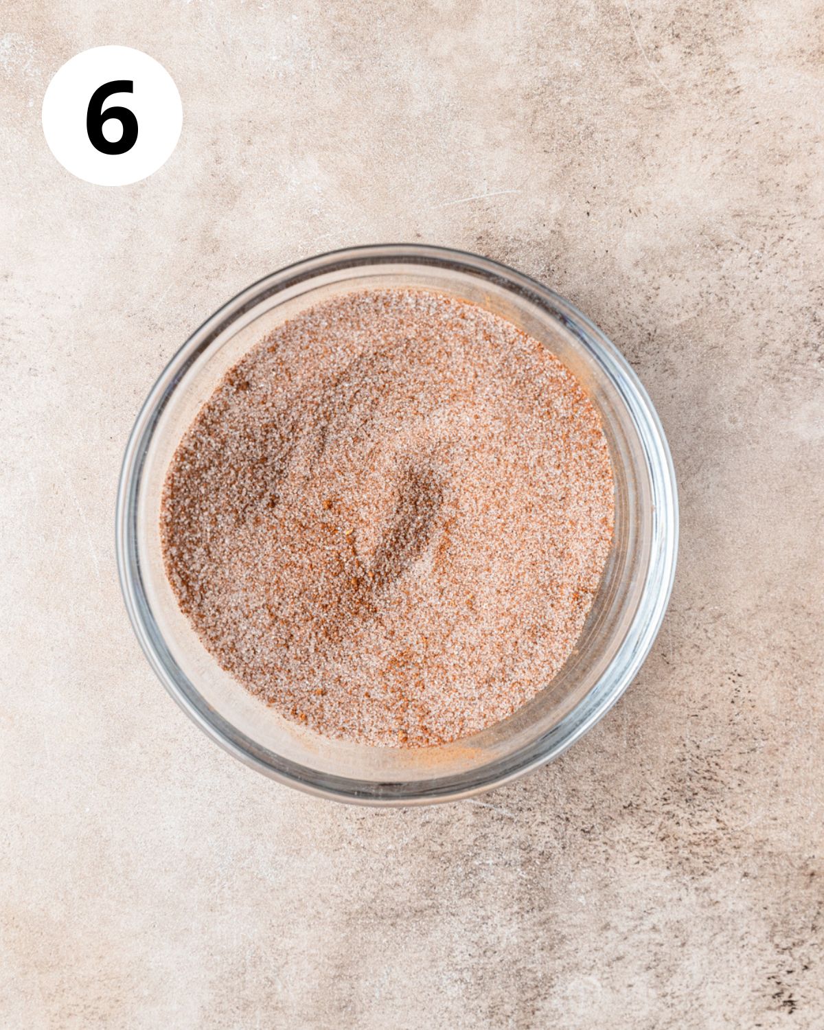 sugar and pumpkin pie spice mixed together in bowl.