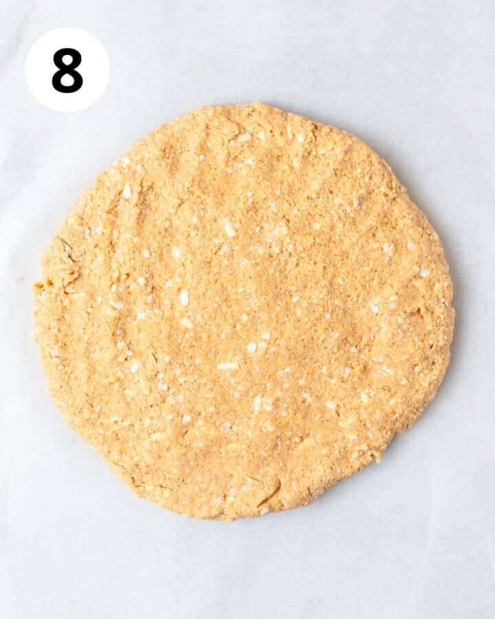 pumpkin scone dough in large circle. 