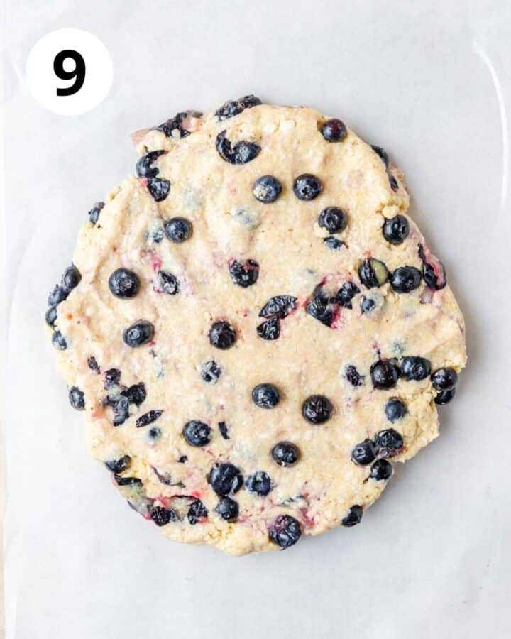 blueberry scone dough in large circle.