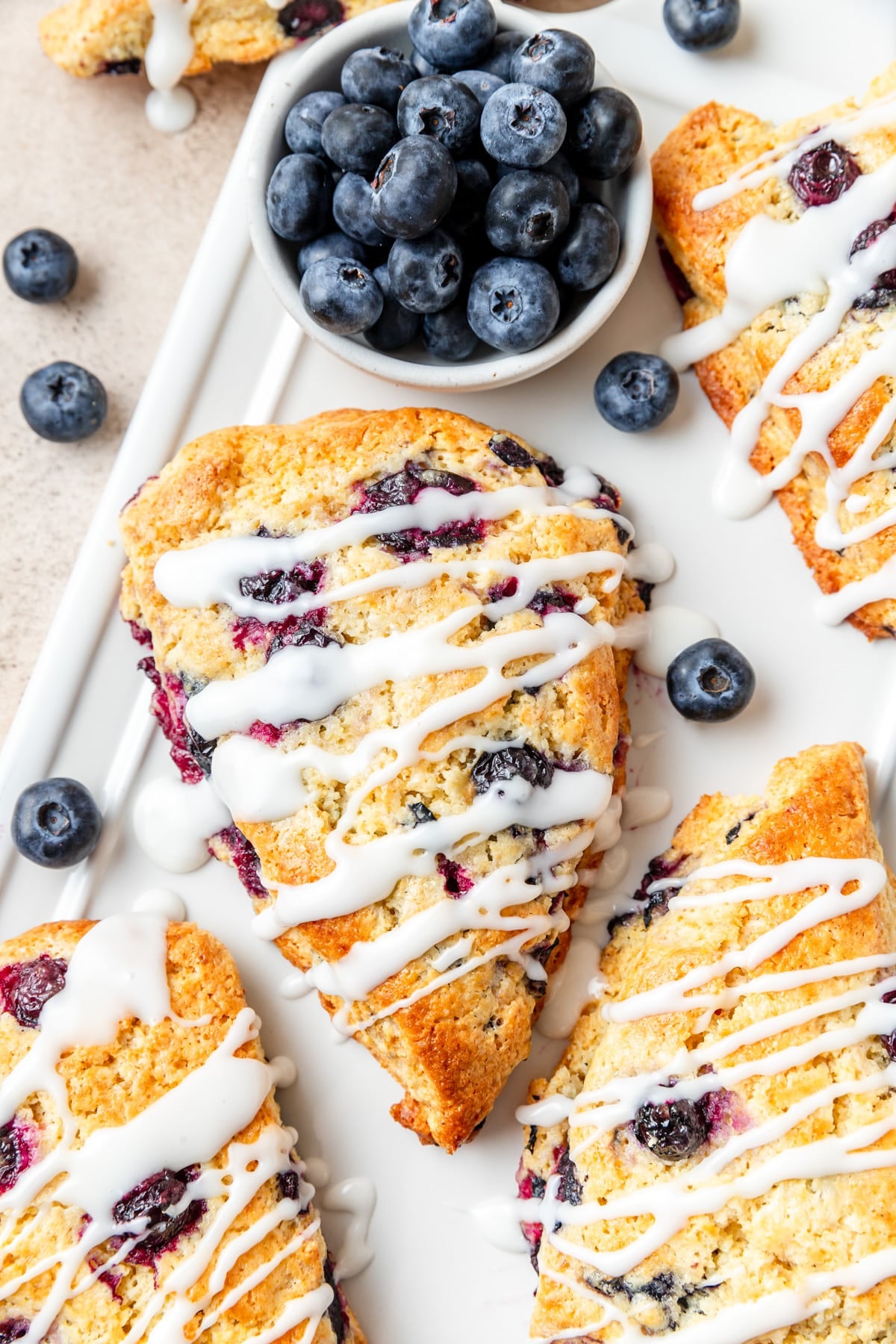 cornmeal blueberry scones with lemon glaze.