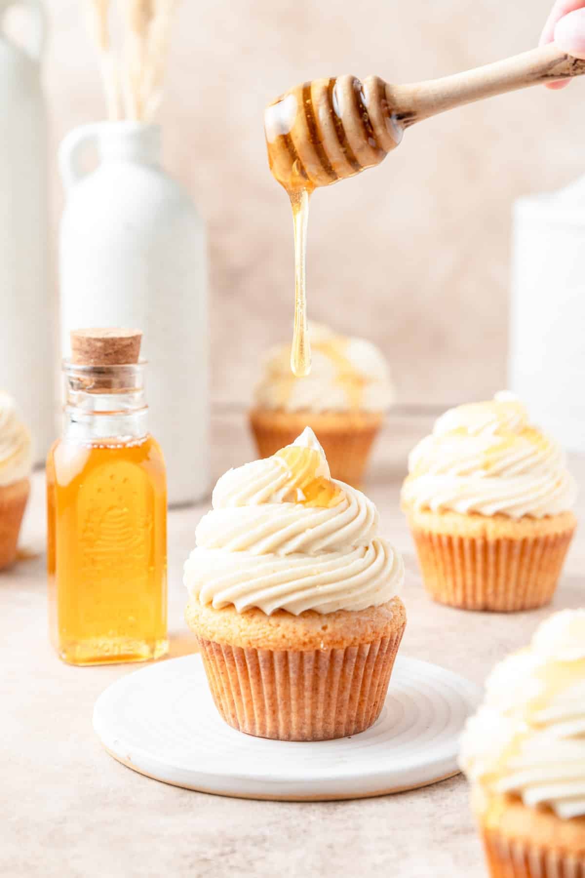 drizzling cornbread cupcakes with honey.
