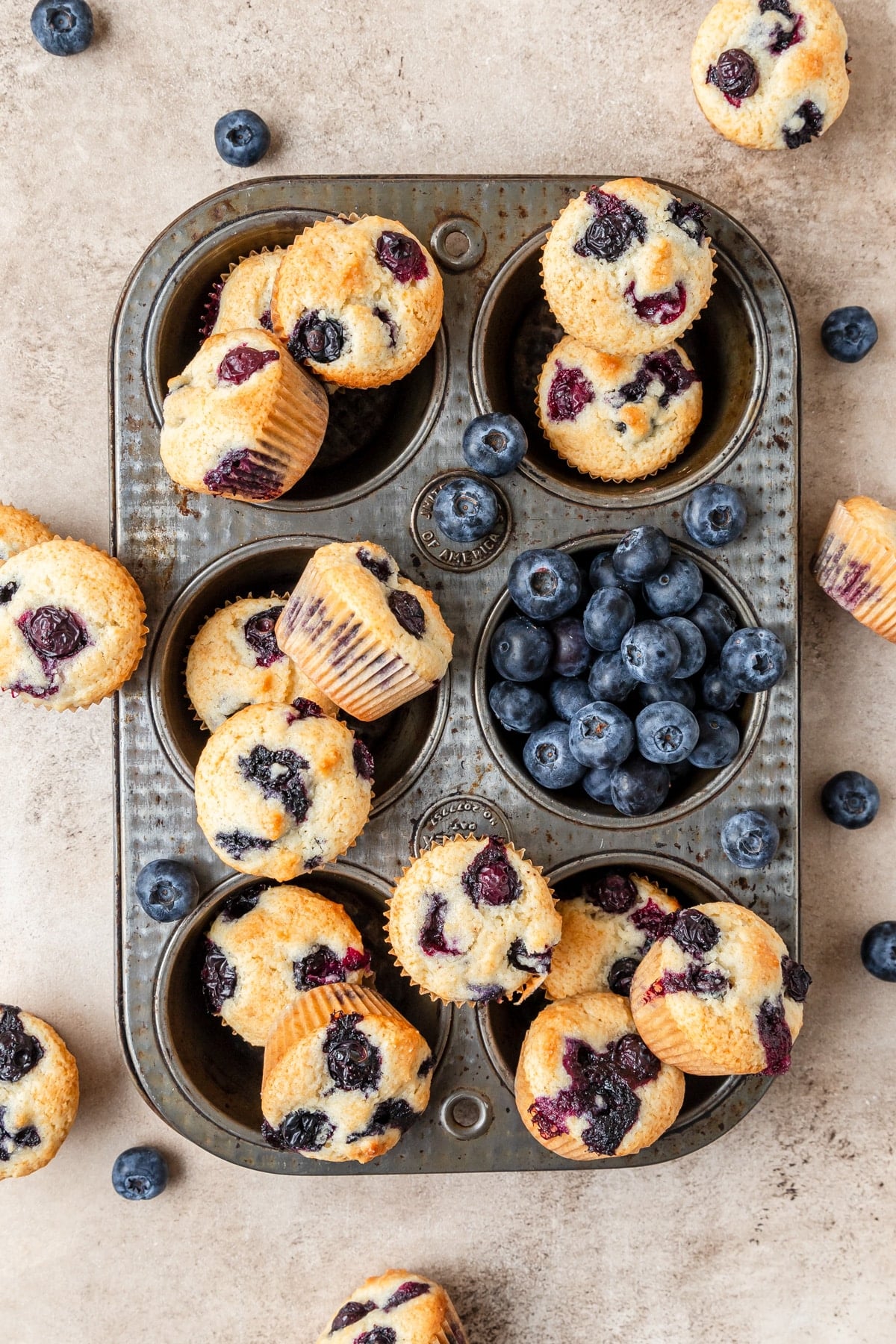 mini blueberry muffins in muffin tray.