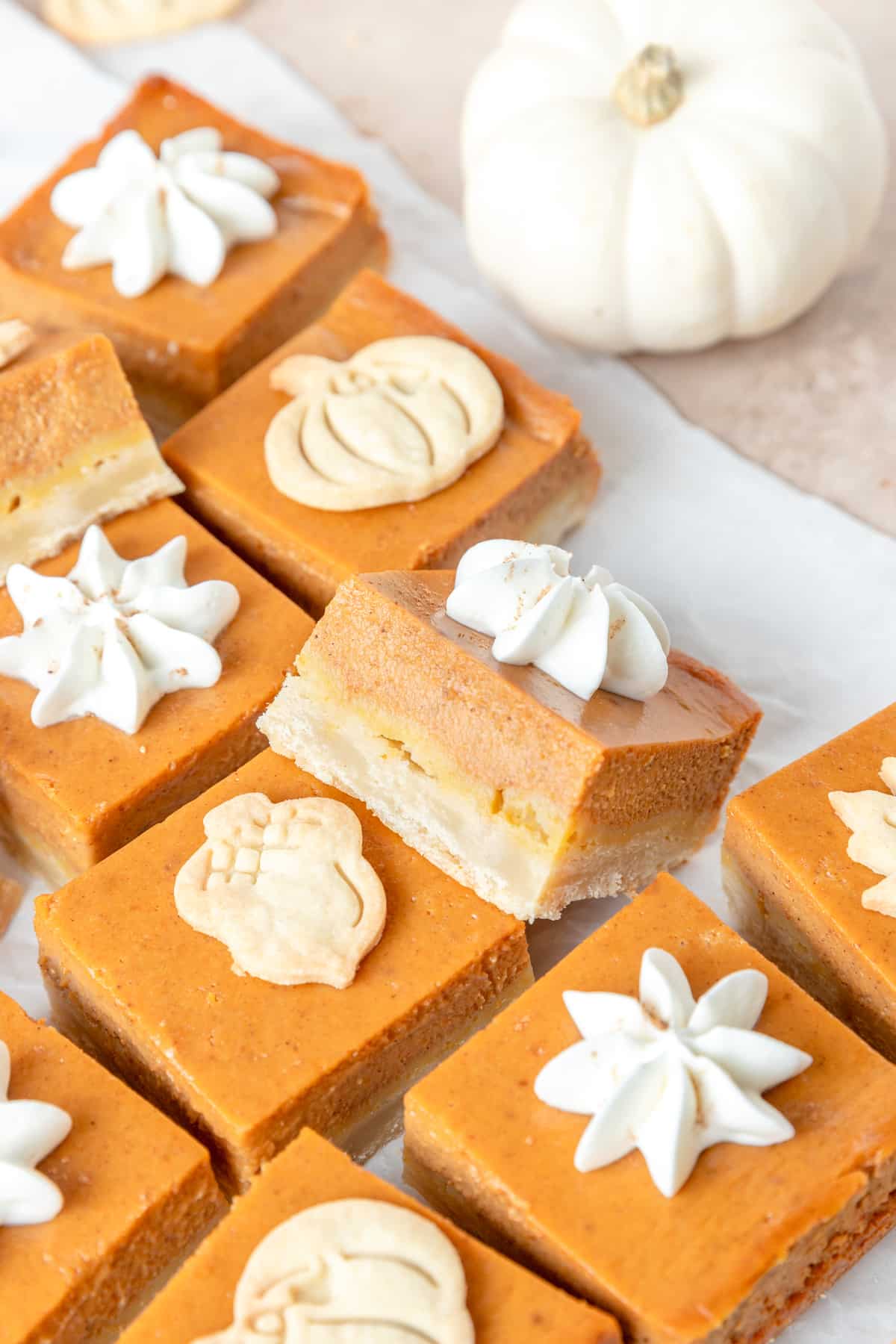 pumpkin pie bars with maple whipped cream.