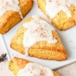 close up of pumpkin scones with maple glaze.