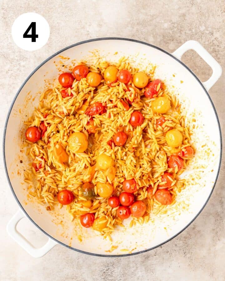 adding orzo to pan with tomatoes.