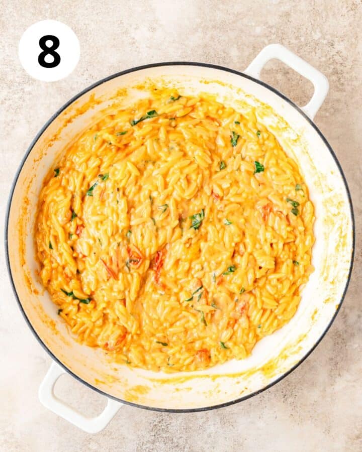 creamy tomato orzo in pan.