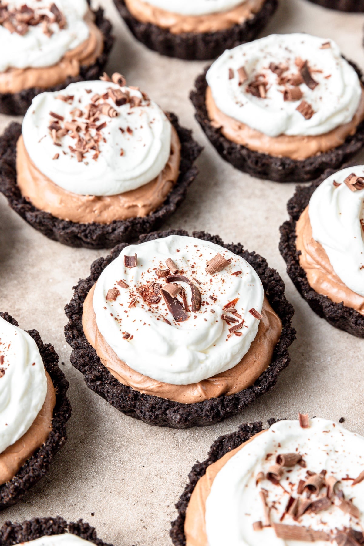 mini chocolate mousse tarts with oreo crust.