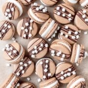 hot chocolate macarons with chocolate ganache and swiss meringue.