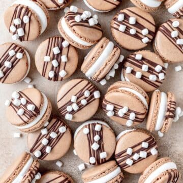hot chocolate macarons with chocolate ganache and swiss meringue.