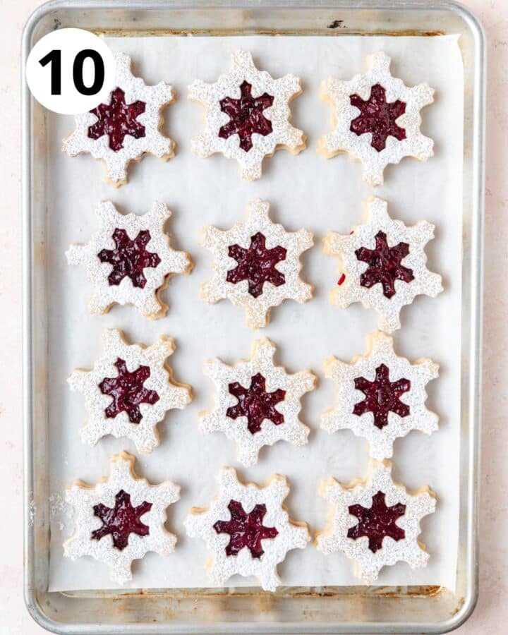 then placing the powdered sugar cookie half on top.