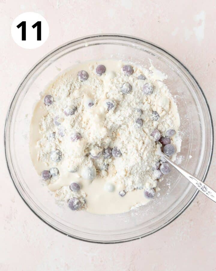 adding wet ingredients to dough.